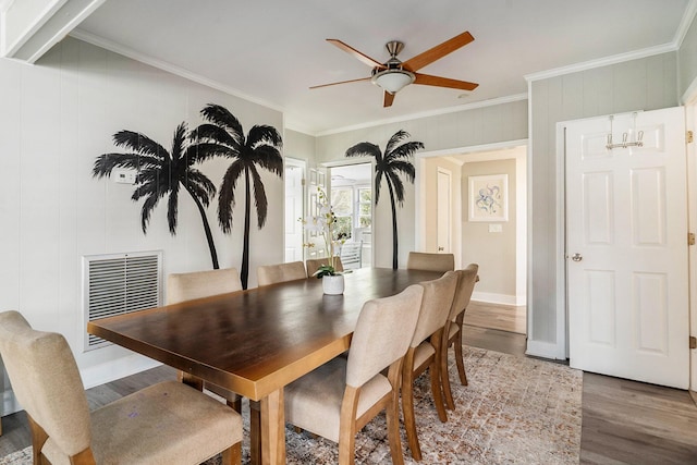504 W Ashley Ave, Folly Beach, SC 29439 - dining space featuring wood finished floors, ceiling fan, and ornamental molding