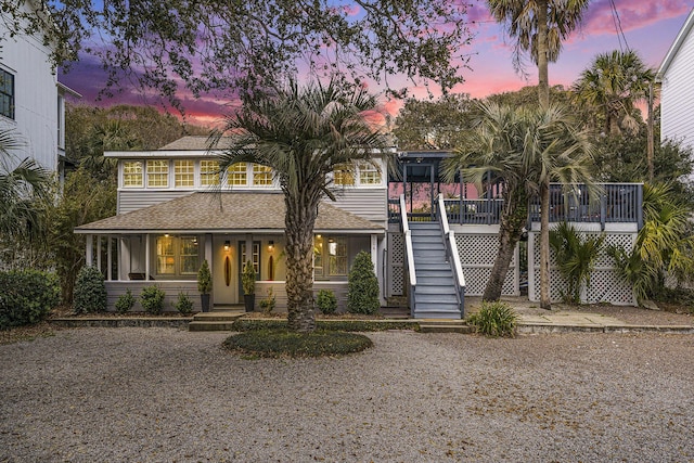504 W Ashley Ave, Folly Beach, SC 29439 - view of front facade with stairway and roof with shingles