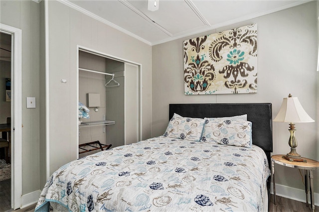 504 W Ashley Ave, Folly Beach, SC 29439 - bedroom featuring wood finished floors, a closet, crown molding, and attic access