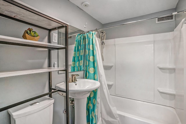 504 W Ashley Ave, Folly Beach, SC 29439 - bathroom featuring shower / tub combo and toilet