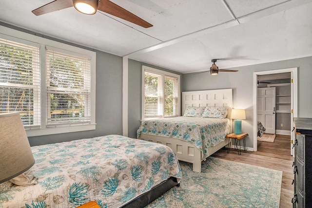504 W Ashley Ave, Folly Beach, SC 29439 - bedroom with multiple windows, wood finished floors, and a ceiling fan