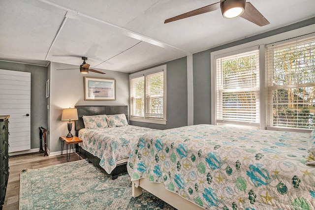 504 W Ashley Ave, Folly Beach, SC 29439 - bedroom featuring wood finished floors and a ceiling fan