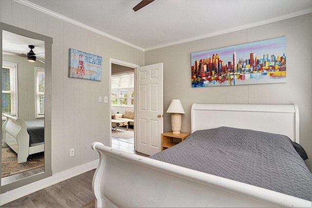 504 W Ashley Ave, Folly Beach, SC 29439 - bedroom featuring wood finished floors, ornamental molding, multiple windows, and a ceiling fan