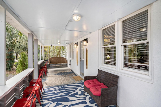 504 W Ashley Ave, Folly Beach, SC 29439 - sunroom featuring track lighting