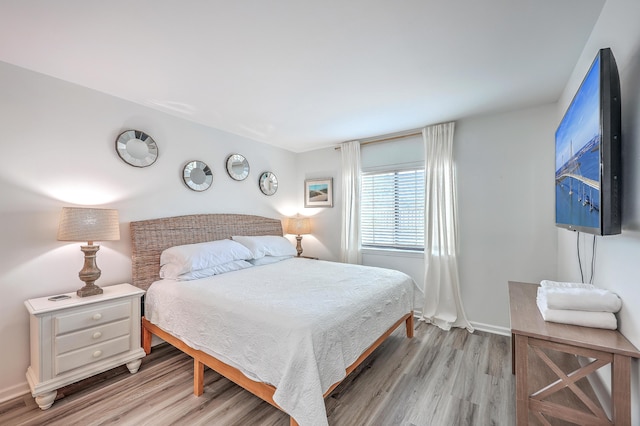 bedroom with light hardwood / wood-style flooring