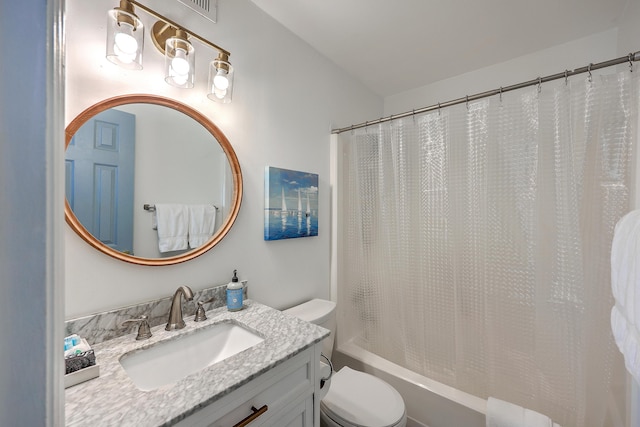 full bathroom featuring toilet, shower / bath combination with curtain, and vanity