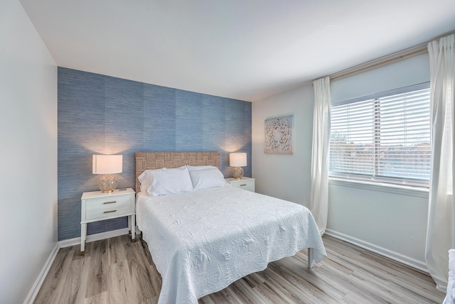 bedroom with light hardwood / wood-style floors