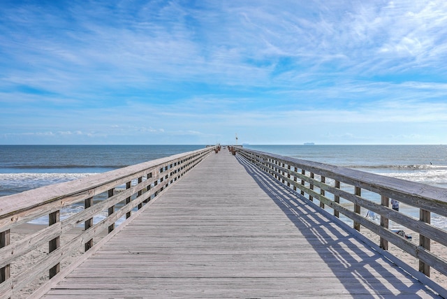 dock area featuring a view of the beach and a water view