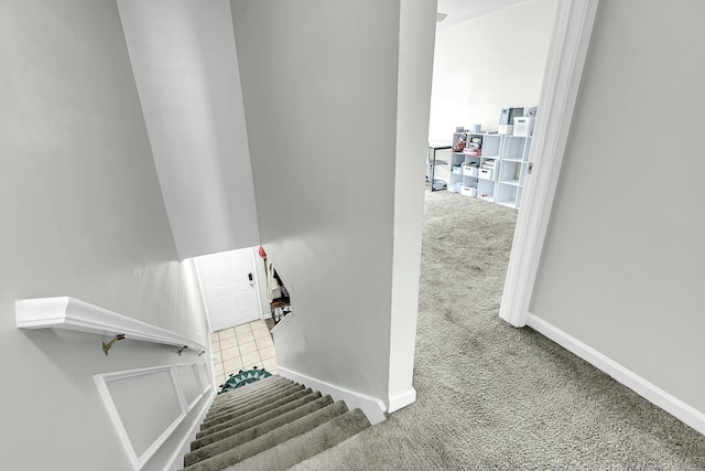 staircase with carpet flooring and baseboards