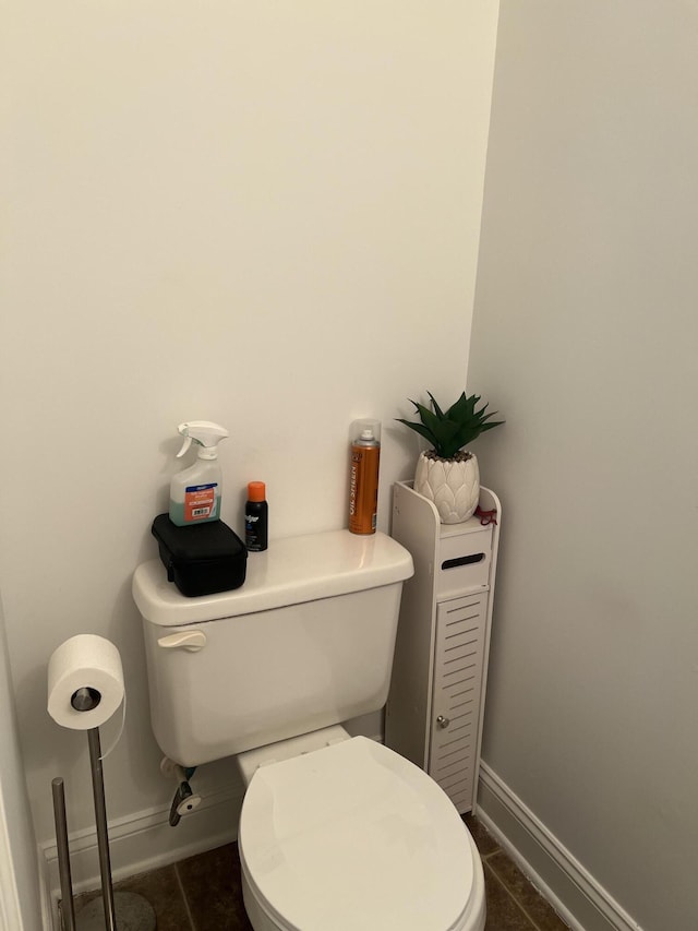 bathroom with tile patterned flooring and toilet