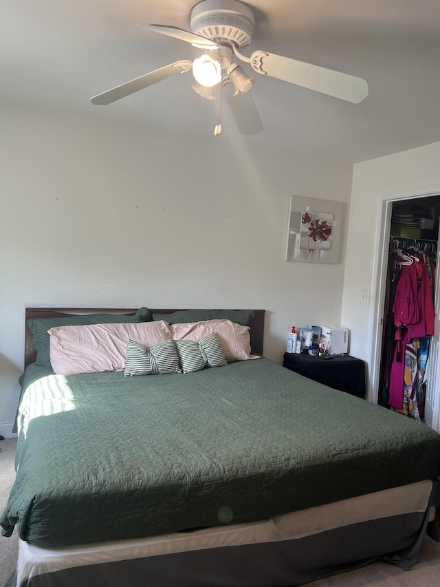 bedroom featuring ceiling fan and carpet