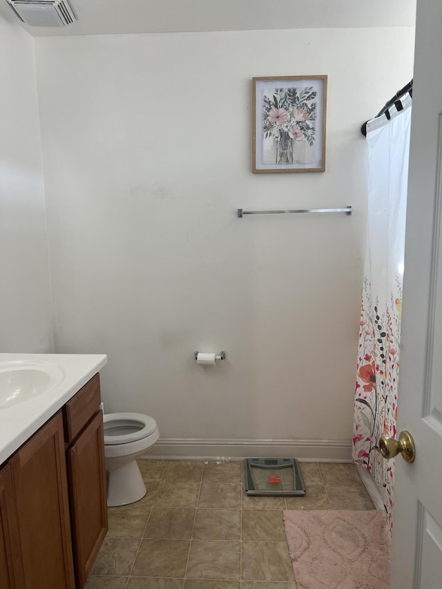 bathroom featuring vanity, toilet, and a shower with shower curtain