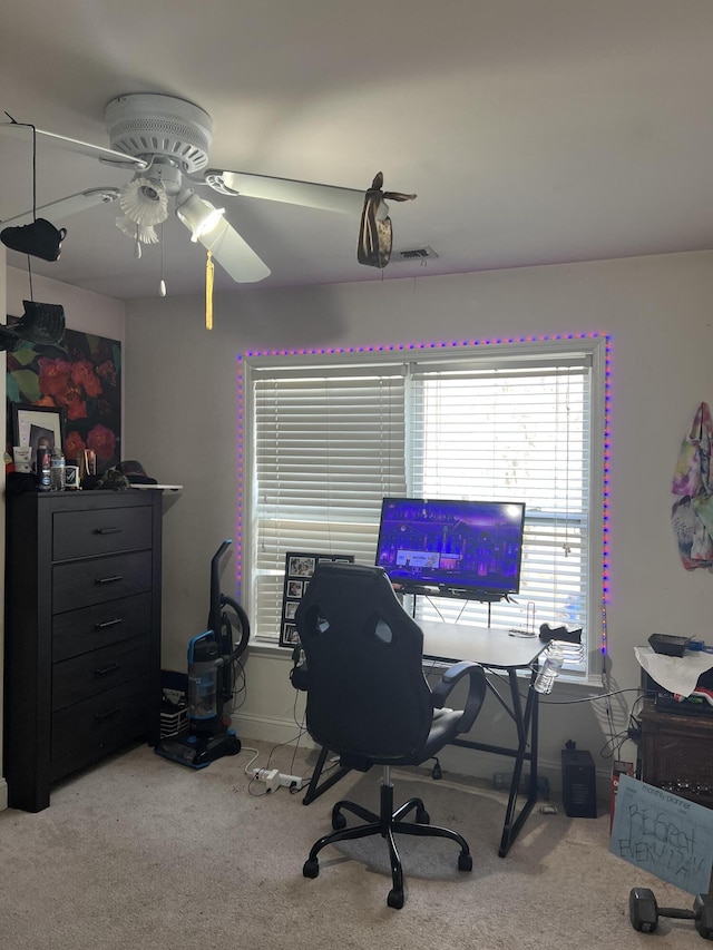 office space with ceiling fan and carpet