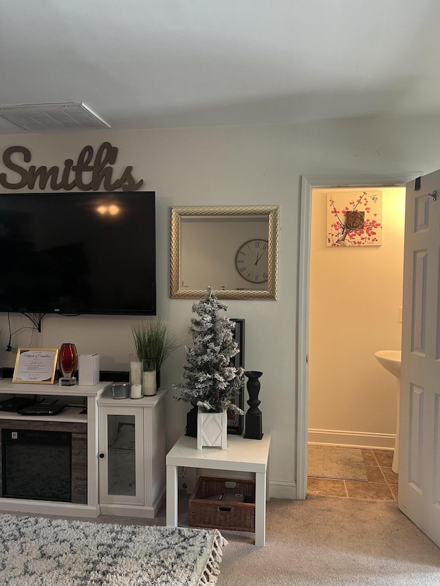 living room featuring light colored carpet