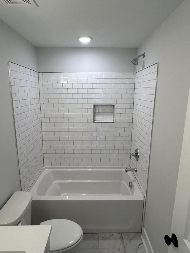 full bathroom featuring vanity, baseboards,  shower combination, toilet, and marble finish floor