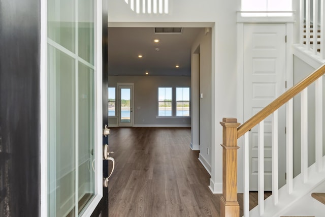 foyer entrance with dark hardwood / wood-style floors