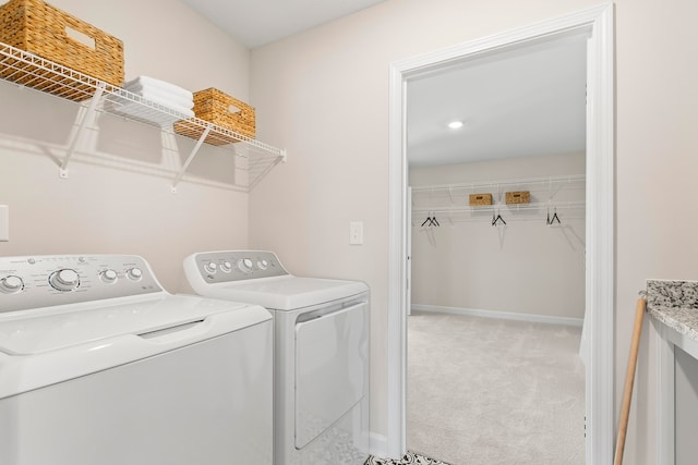 washroom with light colored carpet and washing machine and clothes dryer