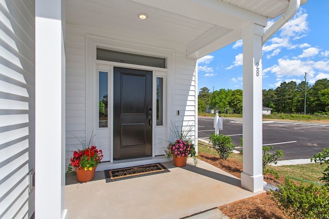 property entrance featuring covered porch