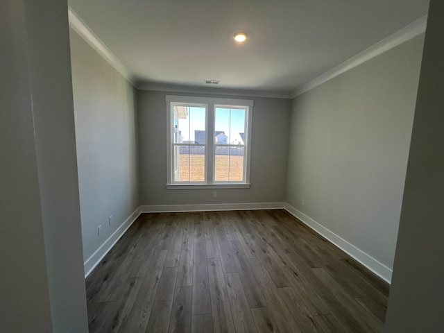 unfurnished room with dark hardwood / wood-style flooring and crown molding