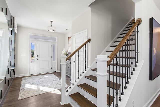 entrance foyer with dark hardwood / wood-style floors