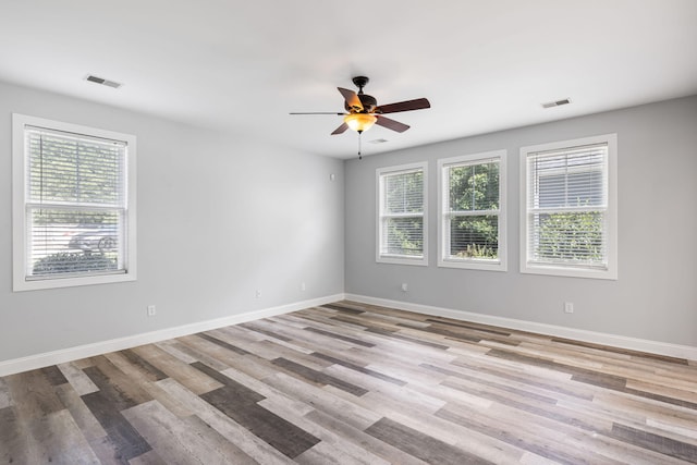 1070 Moss Grove Dr, Moncks Corner, SC 29461 - unfurnished room with healthy amount of natural light, ceiling fan, and wood finished floors