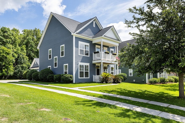 1070 Moss Grove Dr, Moncks Corner, SC 29461 - view of front of house with a balcony and a front lawn