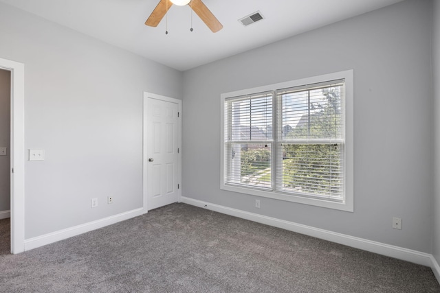 1070 Moss Grove Dr, Moncks Corner, SC 29461 - empty room with dark carpet and a ceiling fan