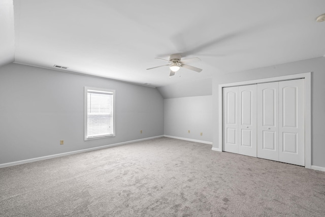 1070 Moss Grove Dr, Moncks Corner, SC 29461 - unfurnished bedroom with vaulted ceiling, carpet, a closet, and ceiling fan