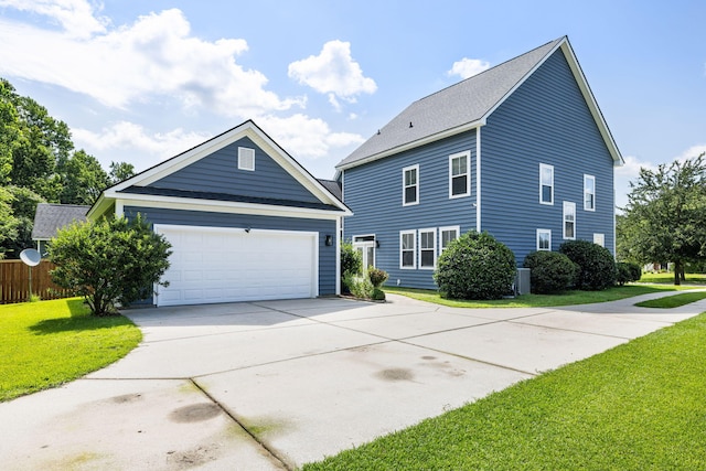1070 Moss Grove Dr, Moncks Corner, SC 29461 - view of front facade featuring a front lawn, concrete driveway, and a garage