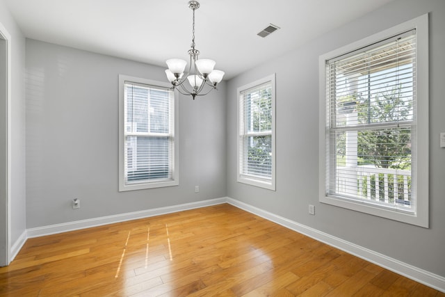 1070 Moss Grove Dr, Moncks Corner, SC 29461 - empty room with a chandelier and light wood-style flooring