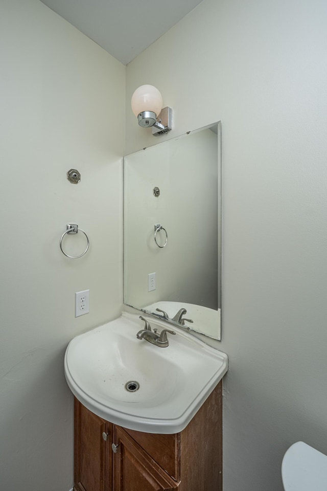 bathroom with toilet and vanity