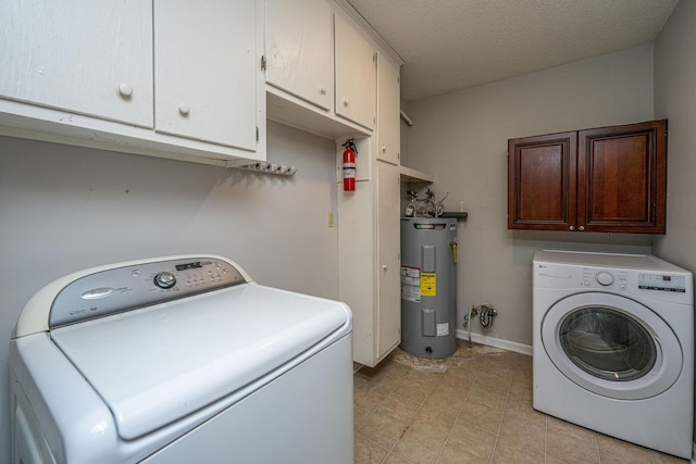 laundry room with water heater, a textured ceiling, cabinet space, and baseboards