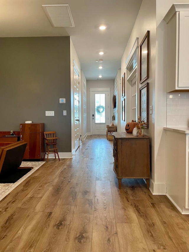 hall with light hardwood / wood-style flooring