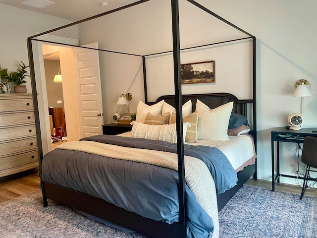 bedroom featuring hardwood / wood-style floors