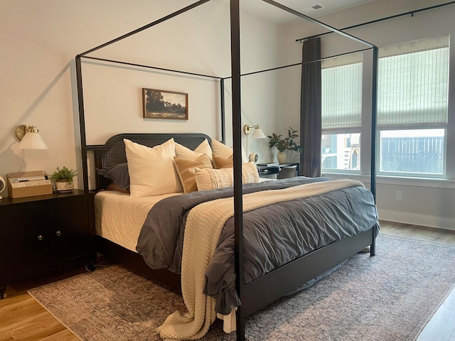 bedroom with hardwood / wood-style floors