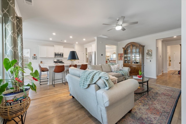 143 Daniels Creek Cir, Goose Creek, SC 29445 - living area with a ceiling fan, recessed lighting, crown molding, light wood-type flooring, and baseboards