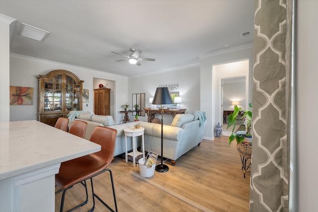 143 Daniels Creek Cir, Goose Creek, SC 29445 - living area with ornamental molding, a ceiling fan, and light wood finished floors