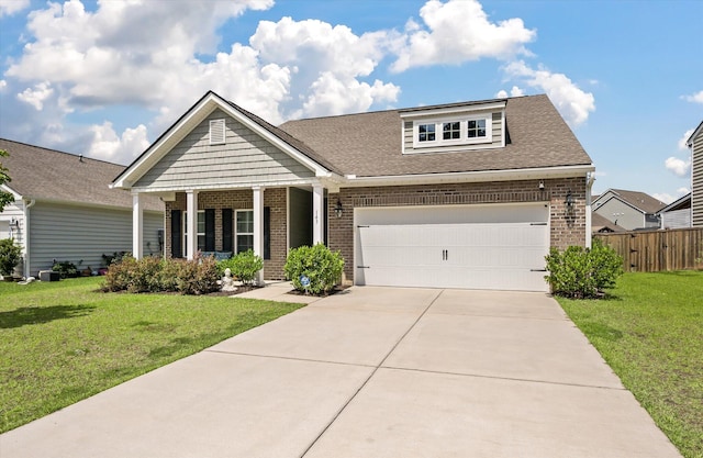 143 Daniels Creek Cir, Goose Creek, SC 29445 - view of front of property with brick siding, driveway, a shingled roof, and a porch
