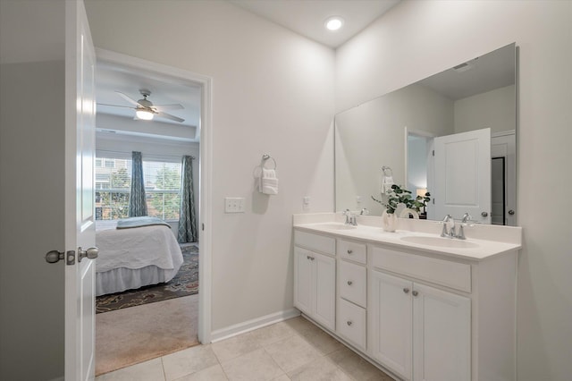 143 Daniels Creek Cir, Goose Creek, SC 29445 - bathroom with double vanity, tile patterned floors, baseboards, connected bathroom, and ceiling fan