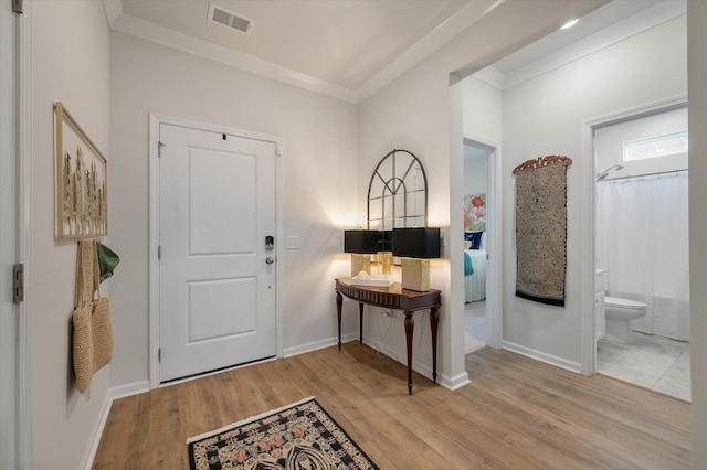 143 Daniels Creek Cir, Goose Creek, SC 29445 - foyer featuring wood finished floors, ornamental molding, and baseboards