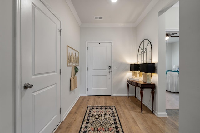 143 Daniels Creek Cir, Goose Creek, SC 29445 - foyer entrance with light wood-type flooring, baseboards, crown molding, and a ceiling fan