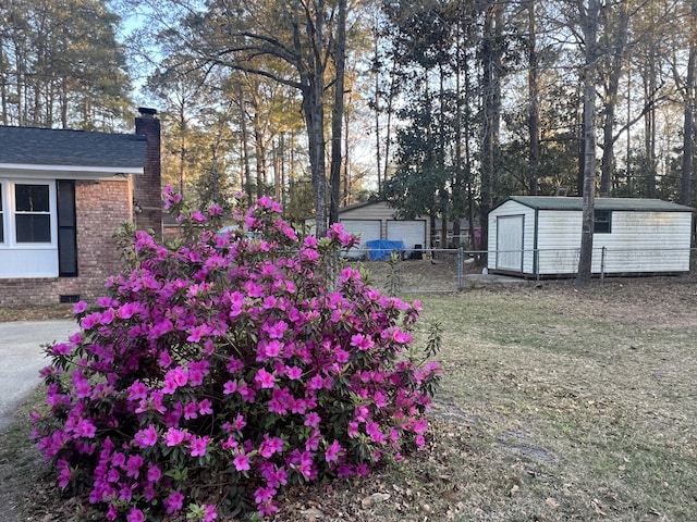 431 Otis Rd, Walterboro, SC 29488 - view of yard with an outbuilding, fence, a garage, and a storage unit