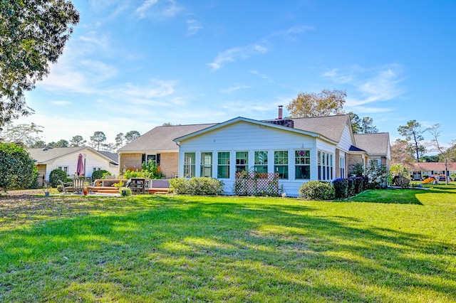 back of house with a yard