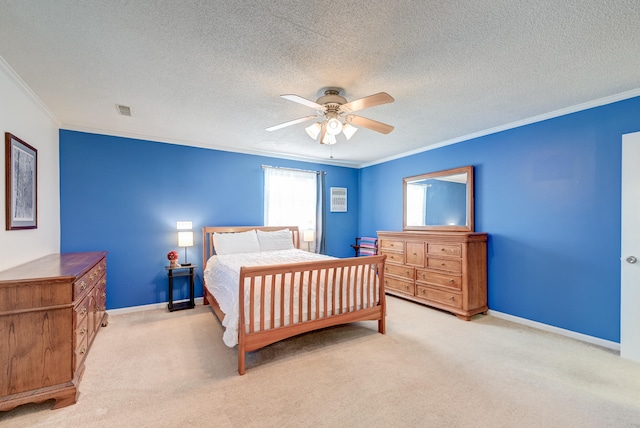 carpeted bedroom featuring a textured ceiling, ceiling fan, and crown molding