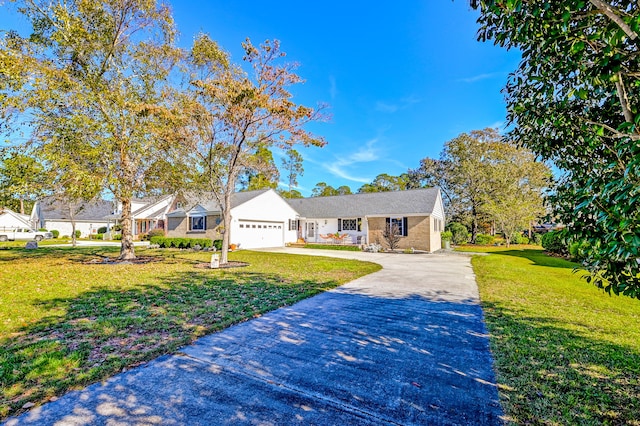 ranch-style home featuring a front yard and a garage