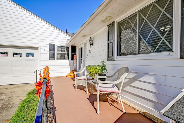 view of patio / terrace featuring a garage