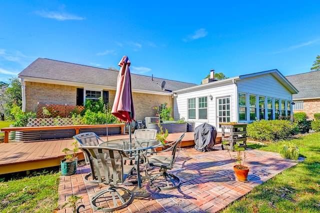 back of house featuring central AC unit and a deck