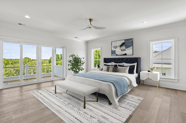 bedroom with ornamental molding, ceiling fan, access to exterior, and light wood-type flooring