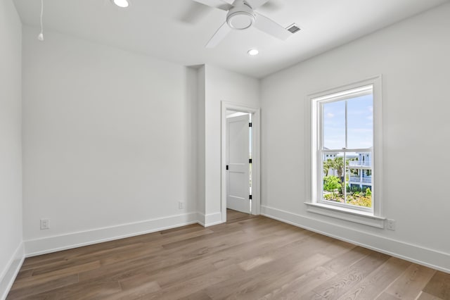 unfurnished room with light hardwood / wood-style flooring and ceiling fan