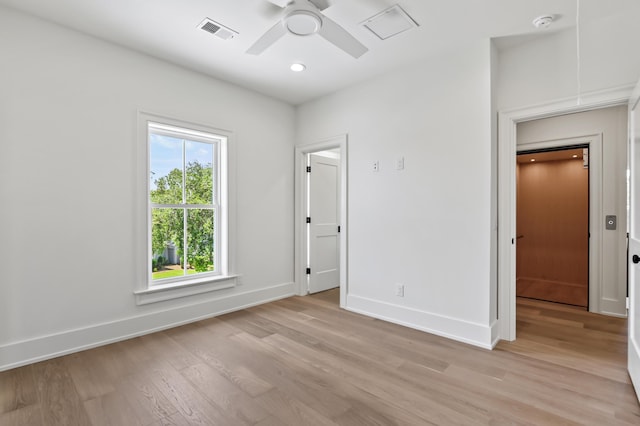 unfurnished bedroom featuring ceiling fan and light hardwood / wood-style floors